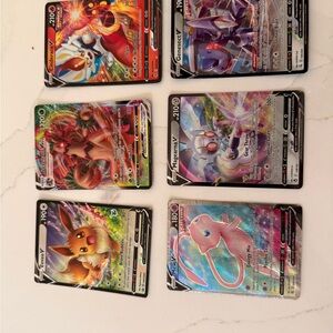 Pokemon Trading Cards - Vibrant Collection with Red, Blue, and Purple